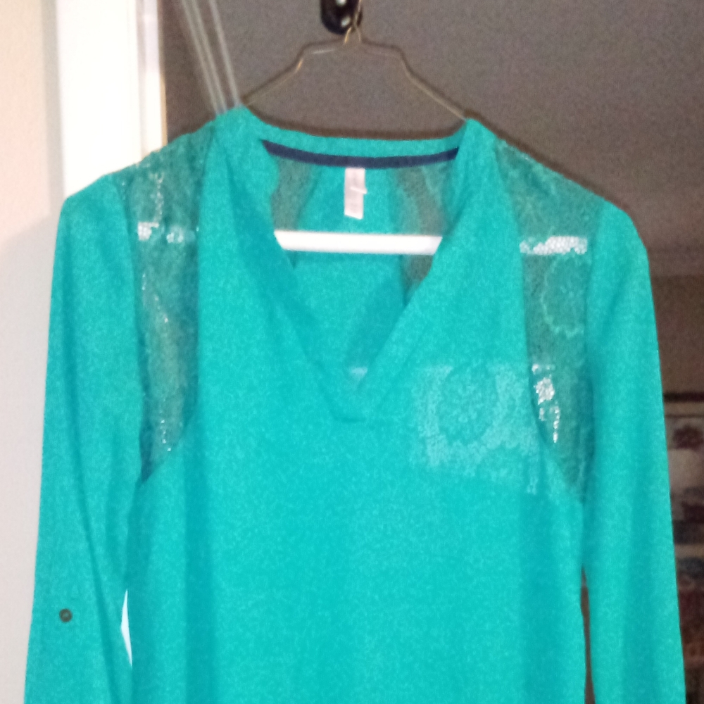 Long sleeve green lace shirt.